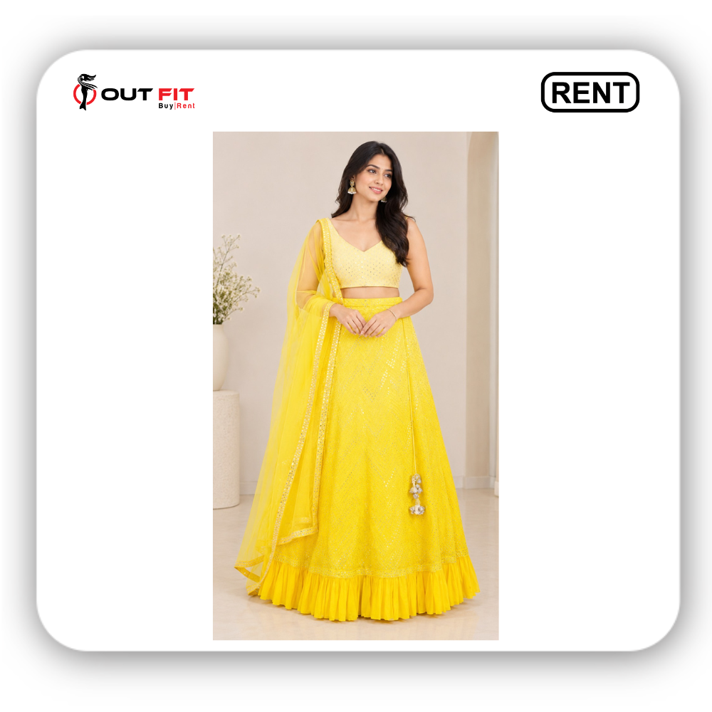 Bright yellow embroidered bridal lehenga for women on rent in Bangalore featuring a pleated ruffled hem, sleeveless V-neck blouse, and matching sheer dupatta Bright yellow embroidered bridal lehenga for women on rent in Bangalore featuring a pleated ruffled hem, sleeveless V-neck blouse, and matching sheer dupatta