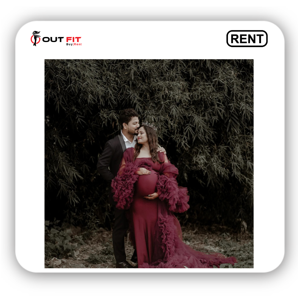 Couple posing in nature with mother wearing royal maroon maternity dress for photoshoot on rent bangalore